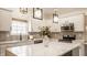 Modern kitchen with stainless steel appliances, white cabinets, backsplash, and an island, perfect for cooking and entertaining at 861 S Park Trail Dr, Carmel, IN 46032