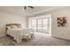 Serene main bedroom with a large bay window, soft lighting, and a comfortable bed, offering a tranquil retreat at 861 S Park Trail Dr, Carmel, IN 46032