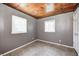Cozy bedroom with neutral paint, natural light, and wood ceiling at 8644 S Kinman Dr, , IN 46164