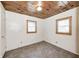 Bedroom with wood ceiling, tile floor and two windows at 8644 S Kinman Dr, , IN 46164