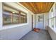 View of the screened porch showcasing wood ceiling and a tiled floor at 8644 S Kinman Dr, , IN 46164
