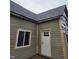 Close up exterior shot featuring new siding, trim, and a new roof at 1016 Dawson St, Indianapolis, IN 46203