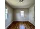 This cozy bedroom features hardwood floors and windows for natural light at 1020 N Colorado Ave, Indianapolis, IN 46201