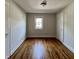 Cozy bedroom with hardwood floors, natural light, and white walls at 1020 N Colorado Ave, Indianapolis, IN 46201