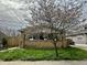 Charming brick bungalow-style home with a well-maintained front lawn at 1020 N Colorado Ave, Indianapolis, IN 46201