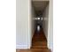 Hallway with hardwood floors leading to the bathroom at 1020 N Colorado Ave, Indianapolis, IN 46201