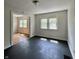 Open-concept living room boasts sleek floors and plenty of natural light at 1020 N Colorado Ave, Indianapolis, IN 46201