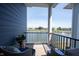 Balcony with comfortable seating and a tranquil view of the lake at 1099 Valentine Ln, Carmel, IN 46032