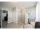 Modern bathroom with a glass shower, vanity, and tile flooring at 1099 Valentine Ln, Carmel, IN 46032
