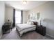 Bedroom showcasing a cozy bed with a desk near the window with plenty of light at 1099 Valentine Ln, Carmel, IN 46032