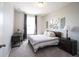Bedroom featuring a cozy bed near a window, complete with a bedside lamp at 1099 Valentine Ln, Carmel, IN 46032