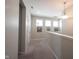 Neutral colored upstairs hallway with carpet, recessed lights and contemporary light fixtures at 1099 Valentine Ln, Carmel, IN 46032