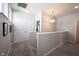 Neutral colored upstairs hallway with carpet and contemporary light fixtures at 1099 Valentine Ln, Carmel, IN 46032