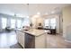 Open-concept kitchen with granite countertops, a central island, and stainless steel appliances at 1099 Valentine Ln, Carmel, IN 46032