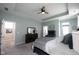 The large main bedroom has carpet, neutral colors, and direct access to the ensuite bath at 1099 Valentine Ln, Carmel, IN 46032
