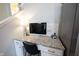 Cozy office nook featuring granite countertops, white cabinets, and ample natural light at 1099 Valentine Ln, Carmel, IN 46032