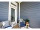 Cozy patio with comfortable seating and neutral-colored cushions near entry at 1099 Valentine Ln, Carmel, IN 46032