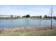 Scenic view of a serene pond, featuring a fountain and neighborhood residences in the background at 1099 Valentine Ln, Carmel, IN 46032