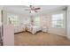 Adorable bedroom featuring carpeted floors, two windows, and lots of dresser storage space at 1109 Oakwood Trl, Indianapolis, IN 46260