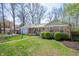 Charming single-story home with brick facade, manicured lawn, and a welcoming front entrance at 1109 Oakwood Trl, Indianapolis, IN 46260