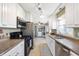 Functional kitchen featuring white cabinets, stainless steel appliances, and granite countertops at 1109 Oakwood Trl, Indianapolis, IN 46260
