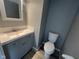 Well-lit bathroom with a modern vanity, mirror, and contemporary fixtures at 11152 Dura Dr, Indianapolis, IN 46229