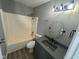 Bathroom with a shower-tub combination and a single sink with black fixtures at 11152 Dura Dr, Indianapolis, IN 46229