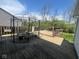 Relax on this home's wooden deck with a metal gazebo and built-in seating, perfect for outdoor gatherings at 11152 Dura Dr, Indianapolis, IN 46229