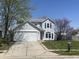 Charming two-story home with a two car garage, lovely landscaping and a beautiful yard at 11152 Dura Dr, Indianapolis, IN 46229