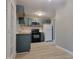 View of kitchen with updated cabinets, hardware, countertops, and appliances at 11152 Dura Dr, Indianapolis, IN 46229