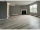 Spacious living room features a fireplace and large window for natural light at 11152 Dura Dr, Indianapolis, IN 46229