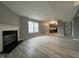 Comfortable living room view with a fireplace and French doors to the kitchen at 11152 Dura Dr, Indianapolis, IN 46229