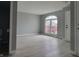 Bright living room with neutral paint, sleek floors, and a large arched window at 11152 Dura Dr, Indianapolis, IN 46229