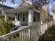 Charming bungalow with a classic picket fence, landscaping, and a pleasant street view at 1140 Hoyt Ave, Indianapolis, IN 46203