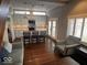 Bright kitchen with stainless appliances, island, and adjacent living area at 1140 Hoyt Ave, Indianapolis, IN 46203