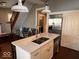 Bright kitchen with a stainless steel refrigerator, white cabinets, and a modern island at 1140 Hoyt Ave, Indianapolis, IN 46203