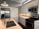 Modern kitchen with an island, stainless steel appliances, and shaker-style cabinets at 1140 Hoyt Ave, Indianapolis, IN 46203