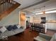 Open-concept living space with eat-in kitchen and staircase at 1140 Hoyt Ave, Indianapolis, IN 46203