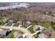 Overhead view of luxurious homes near a serene lake showcases the community's prime location at 11410 Sea Side Dr, Fishers, IN 46040