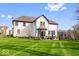 Expansive backyard with lush green lawn and a patio perfect for entertaining at 11410 Sea Side Dr, Fishers, IN 46040