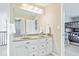 Bright bathroom with a double sink vanity and a view into the bedroom at 11410 Sea Side Dr, Fishers, IN 46040