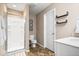 Modern bathroom featuring a glass-enclosed shower, toilet, and white vanity with ample lighting at 11410 Sea Side Dr, Fishers, IN 46040