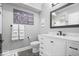 Bathroom featuring modern vanity with a marble countertop, framed mirror, and sleek fixtures for a modern style at 11410 Sea Side Dr, Fishers, IN 46040