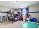 Bedroom featuring bunk beds with a large window for natural light and a blue accent chair at 11410 Sea Side Dr, Fishers, IN 46040