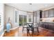 Bright breakfast nook with a modern light fixture and views of the landscaped yard at 11410 Sea Side Dr, Fishers, IN 46040