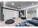 Home theater room with comfortable seating, projector, and soundproofing, offering a luxurious entertainment space at 11410 Sea Side Dr, Fishers, IN 46040