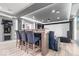 Entertainment room with home theatre, bar seating and modern lighting for a luxurious experience at 11410 Sea Side Dr, Fishers, IN 46040