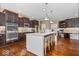 Gourmet kitchen with stainless appliances, double oven, granite countertops, and a large center island with bar seating at 11410 Sea Side Dr, Fishers, IN 46040