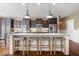 Open kitchen features a large island with seating, stainless steel appliances, and plenty of cabinet space at 11410 Sea Side Dr, Fishers, IN 46040