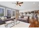 Open-concept living room flows into the kitchen, featuring hardwood floors and lots of natural light at 11410 Sea Side Dr, Fishers, IN 46040